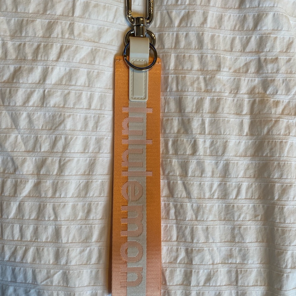 Lululemon Coral and White Keychain